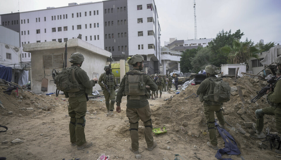 Israeli soldiers stand outside Shifa Hospital in Gaza City, Wednesday, Nov. 22, 2023. Israel says that Hamas militants sought cover on the grounds of the hospital and used the tunnel for military purposes. (AP Photo/Victor R. Caivano) XOB170