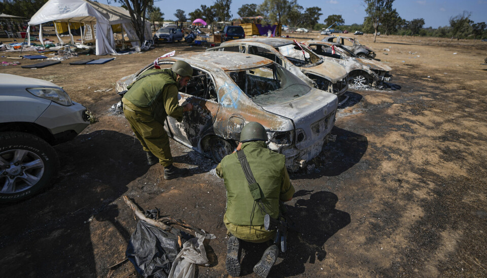 Israeli soldiers inspect the site of a music festival near the border with the Gaza Strip in southern Israel, Friday. Oct. 13, 2023. At least 260 Israeli festival-goers were killed during the attack by Hamas gunmen last Saturday. (AP Photo/Ariel Schalit) XJL508
