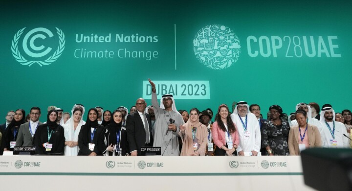 United Nations Climate Chief Simon Stiell, from left, COP28 President Sultan al-Jaber and Hana Al-Hashimi, chief COP28 negotiator for the United Arab Emirates, pose for photos at the end of the COP28 U.N. Climate Summit, Wednesday, Dec. 13, 2023, in Dubai, United Arab Emirates. (AP Photo/Peter Dejong) COP297