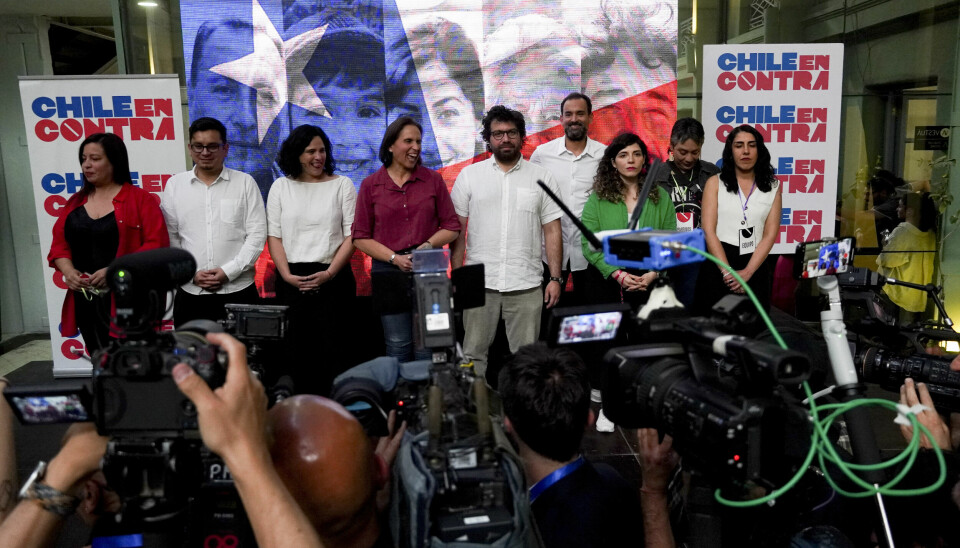 Members of the campaign team against the draft of a new constitution talk to journalists after the polls closed in Santiago, Chile, Sunday, Dec. 17, 2023. For the second time in as many years, Chileans voted in a referendum on whether to replace the current constitution which dates back to the military dictatorship of Gen. Augusto Pinochet. (AP Photo/Matias Basualdo) XNP154