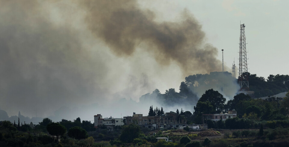 Smoke rises from an Israeli army position which was attacked by Hezbollah fighters near Alma al-Shaab a Lebanese border village with Israel, south Lebanon, Sunday, Oct. 15, 2023. Hamas Palestinian militants in southern Lebanon fired 20 rockets into the northern Israeli towns of Schlomi and Nahariyya, the group said in a statement. They said it was 'in response to the (Israeli) occupation's crimes against our people in Gaza'. (AP Photo/Hussein Malla) XHM115