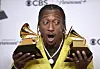 Lecrae poses in the press room with the awards for best contemporary christian music performance/song for 'Your Power' and best contemporary christian music album for 'Church Clothes 4' during the 66th annual Grammy Awards on Sunday, Feb. 4, 2024, in Los Angeles. (Photo by Richard Shotwell/Invision/AP) CAGB741