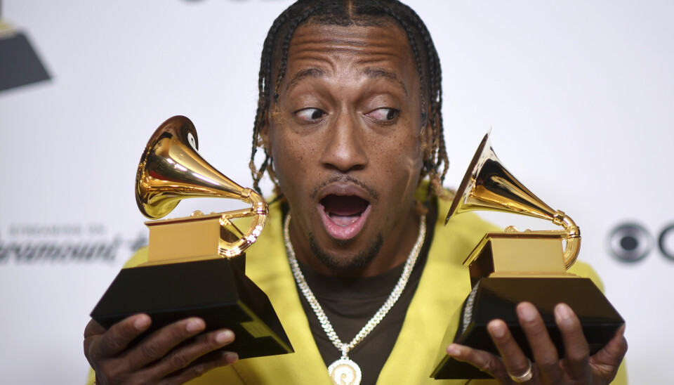 Lecrae poses in the press room with the awards for best contemporary christian music performance/song for 'Your Power' and best contemporary christian music album for 'Church Clothes 4' during the 66th annual Grammy Awards on Sunday, Feb. 4, 2024, in Los Angeles. (Photo by Richard Shotwell/Invision/AP) CAGB741