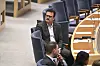Jamal El-Haj sitter i plenisalen i riksdagen.