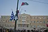 A protester waves a Palestinian flag during a demonstration against the war in the Gaza Strip, Israel's measures regarding food distribution outside Greece's Parliament in central Athens, Thursday, July 24, 2025. (AP Photo/Petros Giannakouris) XPG106