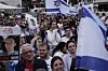 People gather at a plaza known as hostages square in Tel Aviv, Israel, Monday, Oct. 13, 2025, before the release of Israeli hostages held in Gaza. (AP Photo/Oded Balilty) BA117