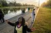 Worshipers listen to a sermon by Mark Batterson, lead pastor of National Community Church, during a sunrise Easter service at the Lincoln Memorial in Washington, Sunday, March 31, 2024. (AP Photo/Nathan Howard) DCNH105