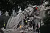 Rescuers search for victims in a collapsed building following an earthquake in Caracas on June 24, 2026. A magnitude 7.1 earthquake struck Venezuela on Wednesday, the United States Geological Survey (USGS) reported, triggering panic in Caracas, according to AFP journalists. The tremor, which was followed by several aftershocks, was also felt in Colombia. (Photo by Juan BARRETO / AFP)