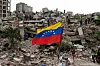 Residents and rescue workers search through the rubble of buildings damaged in the earthquakes that struck La Guaira, Venezuela, Thursday, July 2, 2026. (AP Photo/Ariana Cubillos) XRM141