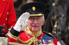 Britain's King Charles III salutes as he rides with Queen Camilla in a open top carriage during Trooping The Colour, the King's annual birthday parade, in London, Saturday, June 13, 2026. (AP Photo/Kirsty Wigglesworth) XAG109