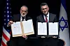 Israeli Foreign Minister Gideon Sa'ar (right) and U.S. Ambassador to Israel Mike Huckabee present the land‑allocation agreement for the permanent U.S. Embassy in Jerusalem to the audience during a ceremony on Wednesday, July 1, 2026. (AP Photo/Ohad Zwigenberg) OZW105