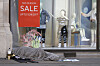 A homeless person sleeps in front of a closed clothing shop in London, Thursday May 14, 2020, as the country continues in lockdown to help stop the spread of coronavirus. Some of the coronavirus lockdown measures are being relaxed in England, after weeks of lockdown, latest figures show the largest quarterly contraction in the UK economy since the financial crisis. (AP Photo/Kirsty Wigglesworth) LKW104